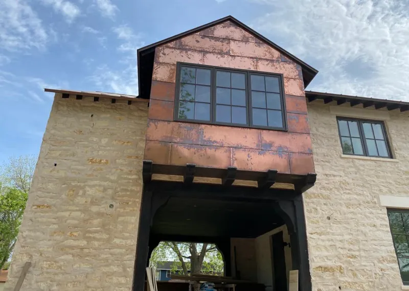 Copper metal panel facade on a stone building for Skylight Installation in Upper Saucon